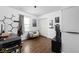 Spacious room featuring dark hardwood floors, modern decor and comfortable chair at 6223 N Parker Ave, Indianapolis, IN 46220