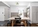Bright dining room featuring a rustic wooden table, bench seating, and elegant decor at 6223 N Parker Ave, Indianapolis, IN 46220