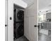 Efficient laundry space features a stackable washer and dryer unit with door open to the kitchen at 6223 N Parker Ave, Indianapolis, IN 46220