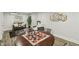 Basement features seating, a game area, and modern decor providing a versatile and stylish living space at 625 N Temple Ave, Indianapolis, IN 46201