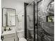 Modern bathroom featuring a glass shower, stylish tiles, and a sink at 625 N Temple Ave, Indianapolis, IN 46201