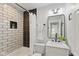 Renovated bathroom featuring subway tile and black hardware and decor accents at 625 N Temple Ave, Indianapolis, IN 46201
