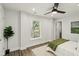 Bright bedroom with a ceiling fan and an outside view at 625 N Temple Ave, Indianapolis, IN 46201