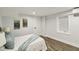 Cozy bedroom featuring hardwood floors, recessed lighting, a window, mini-split AC unit, and sailboat art at 625 N Temple Ave, Indianapolis, IN 46201