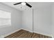 Simple bedroom with hardwood floors, window, and neutral paint, perfect for customization at 625 N Temple Ave, Indianapolis, IN 46201