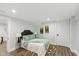 Inviting bedroom with hardwood floors, ample natural light, and serene ambiance at 625 N Temple Ave, Indianapolis, IN 46201