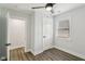 Bright bedroom with neutral colors, wood-look floors, white trim, and a window, creating a calm and inviting space at 625 N Temple Ave, Indianapolis, IN 46201