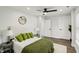 Well-lit bedroom showcasing a queen bed, hardwood floors, and a natural-light-filled window at 625 N Temple Ave, Indianapolis, IN 46201