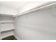 Spacious walk-in closet featuring hardwood floors, ample shelving, and a hanging rod at 625 N Temple Ave, Indianapolis, IN 46201