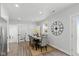 Dining room with seating for six, modern decor, and easy access to a half bathroom at 625 N Temple Ave, Indianapolis, IN 46201