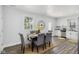 Dining room with hardwood floors, modern decor, and stainless steel appliances that offers space for Gathering at 625 N Temple Ave, Indianapolis, IN 46201