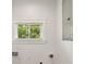 Bright laundry area with a view, featuring a window, electrical panel, and utility connections at 625 N Temple Ave, Indianapolis, IN 46201