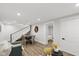 Open-concept living room and dinning room with hardwood floors and bright white paint at 625 N Temple Ave, Indianapolis, IN 46201