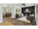 Bright living room boasts hardwood floors, a decorative fireplace, and an open layout that offers space for entertaining at 625 N Temple Ave, Indianapolis, IN 46201
