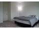 Simple bedroom with a bed, lamp, and neutral carpet at 6304 Frst Brk Dr, Indianapolis, IN 46259