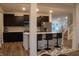 Stylish kitchen with dark cabinets, stainless steel appliances, white countertops, and a kitchen island at 6304 Frst Brk Dr, Indianapolis, IN 46259
