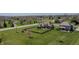 Aerial view of a home with well-kept lawn, fenced backyard with patio, and mature landscaping at 6472 Independence Ct, Pendleton, IN 46064