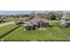 Aerial view of a well manicured property with a large fenced backyard featuring a deck and patio at 6472 Independence Ct, Pendleton, IN 46064