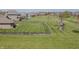 Expansive backyard with lush green lawn, wood fence, and playset in a desirable residential neighborhood at 6472 Independence Ct, Pendleton, IN 46064