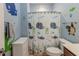 This colorful bathroom features a shower curtain with sea creatures and blue walls at 6472 Independence Ct, Pendleton, IN 46064