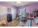 Cozy bedroom with purple walls features a desk, closet and a full size bed at 6472 Independence Ct, Pendleton, IN 46064