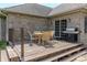 Back deck featuring an outdoor dining table with chairs and a stainless steel grill for entertaining at 6472 Independence Ct, Pendleton, IN 46064