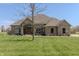 Stunning single-story brick home featuring a well-maintained lawn and a mature, leafless tree in the yard at 6472 Independence Ct, Pendleton, IN 46064