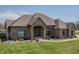 Attractive single-story brick home with lush lawn, a paved walkway and a covered entryway with decorative accents at 6472 Independence Ct, Pendleton, IN 46064