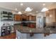 Stylish kitchen features dark granite countertops and modern fixtures, perfect for cooking at 6472 Independence Ct, Pendleton, IN 46064