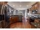 Modern kitchen showcasing stainless appliances, granite countertops, wood cabinets, and hardwood floors at 6472 Independence Ct, Pendleton, IN 46064