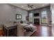 Inviting living room with a fireplace, hardwood floors, and comfortable seating area at 6472 Independence Ct, Pendleton, IN 46064