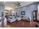 Spacious living room with hardwood floors, large sectional sofa, and a dining area at 6472 Independence Ct, Pendleton, IN 46064