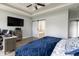 Large bedroom with a view of attached bathroom, a work area, and a modern ceiling fan at 6472 Independence Ct, Pendleton, IN 46064