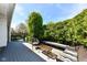 This wooden deck with black railings features built-in bench seating and a wicker seating area at 7332 Quartz Rock Rd, Indianapolis, IN 46236