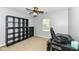 Bedroom with storage units, ceiling fan, carpet flooring, and a window at 7332 Quartz Rock Rd, Indianapolis, IN 46236