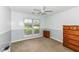 Bedroom with natural light, ceiling fan, neutral paint, and wood furniture at 7332 Quartz Rock Rd, Indianapolis, IN 46236