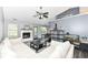 Bright living room with white sofa, fireplace, decor and view into dining area at 7332 Quartz Rock Rd, Indianapolis, IN 46236