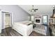 Cozy living room featuring a white sofa, a ceiling fan, and a fireplace at 7332 Quartz Rock Rd, Indianapolis, IN 46236