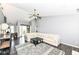 Open living room with dark floors, large sofa, coffee table, and entry view at 7332 Quartz Rock Rd, Indianapolis, IN 46236