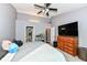 Comfortable main bedroom features a ceiling fan, gray walls, and an ensuite bathroom with attached closet at 7332 Quartz Rock Rd, Indianapolis, IN 46236