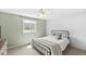 Bedroom with a large window and neutral color scheme at 7656 Madden Ln, Fishers, IN 46038