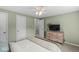 Bedroom with a ceiling fan, closet, and light green walls at 7656 Madden Ln, Fishers, IN 46038