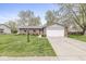 Charming brick home with an attached two car garage, manicured lawn, and a welcoming entryway at 7656 Madden Ln, Fishers, IN 46038