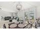 Open-concept space blending living and dining areas, enhanced by a view of the outdoor deck for easy indoor/outdoor living at 7656 Madden Ln, Fishers, IN 46038