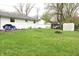 Large backyard with patio, seating, and shed is perfect for relaxing or entertaining at 8017 Chiltern Dr, Indianapolis, IN 46268