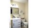 Modern bathroom with a white vanity, sleek fixtures, and a stylish mirror at 8017 Chiltern Dr, Indianapolis, IN 46268
