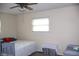Bright bedroom featuring neutral walls, a window, and cozy decor at 8017 Chiltern Dr, Indianapolis, IN 46268