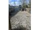 Gravel backyard including debris and a shed at 818 W 27Th St, Indianapolis, IN 46208