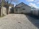 Backyard featuring a gravel area with debris and partial fencing at 818 W 27Th St, Indianapolis, IN 46208