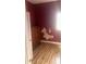This bedroom offers natural light, hardwood floors, and a wardrobe at 818 W 27Th St, Indianapolis, IN 46208